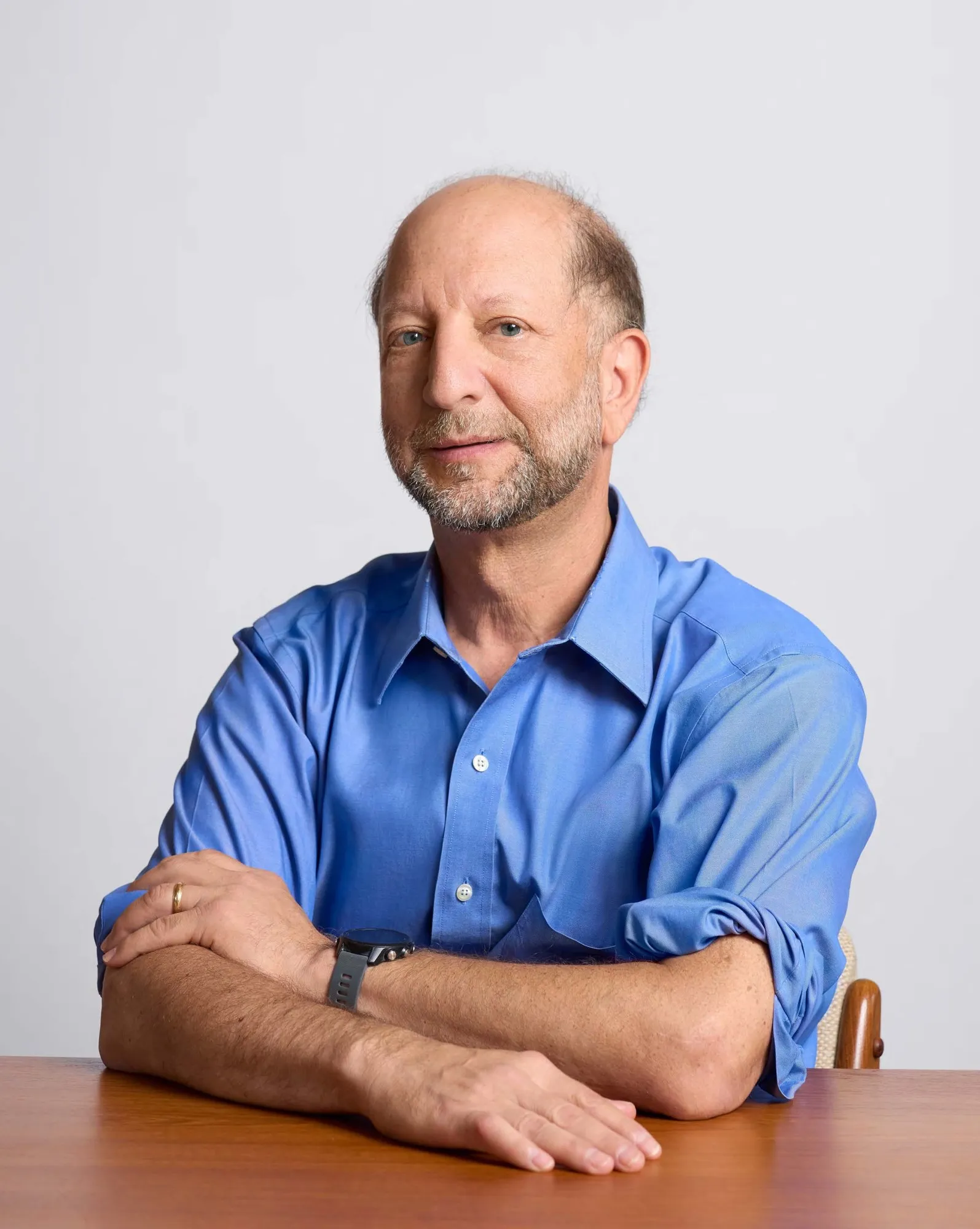 Eric Caplan, PhD, seated at a table